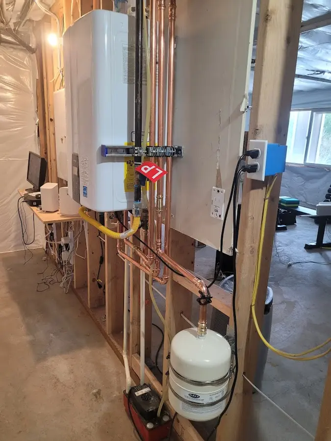 Licensed plumber repairing a kitchen sink in Centerville